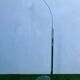 Chromed metal and glass floor lamp designed by Fontana Arte, Falena model by Alvaro Siza, 1990