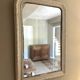 Antique Louis-Philippe mirror with pearls and shells, white patina.
