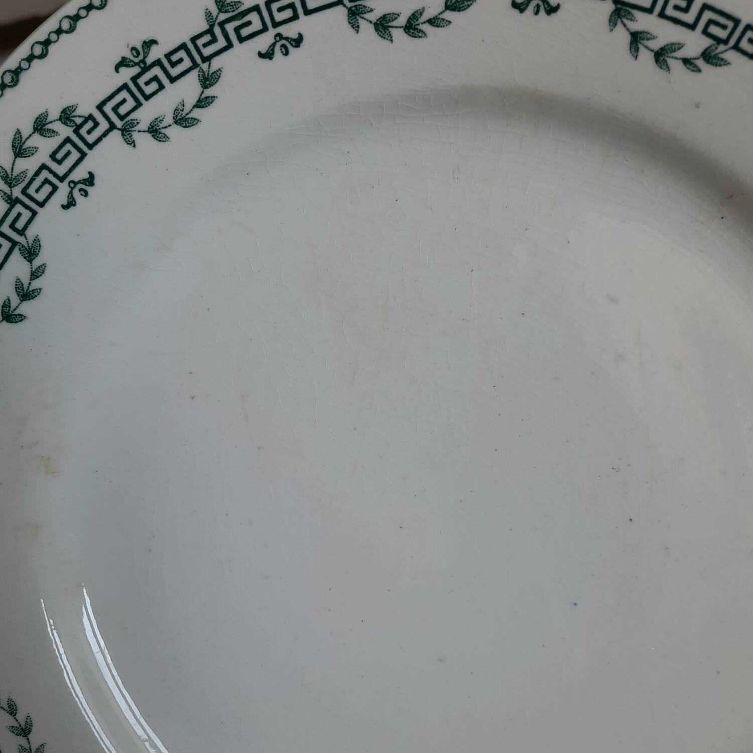 Old mismatched iron earthenware dessert plates accompanied by a dish