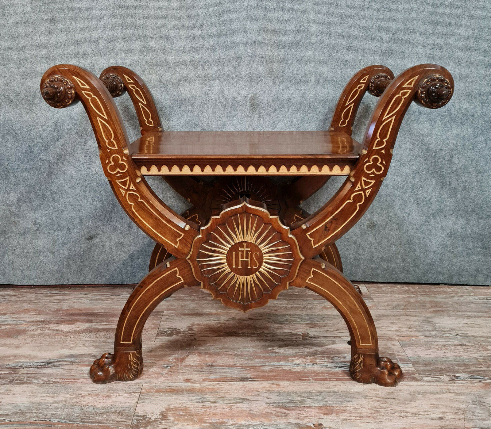 Bishop's curule armchair in solid walnut and gilding highlights with religious symbols