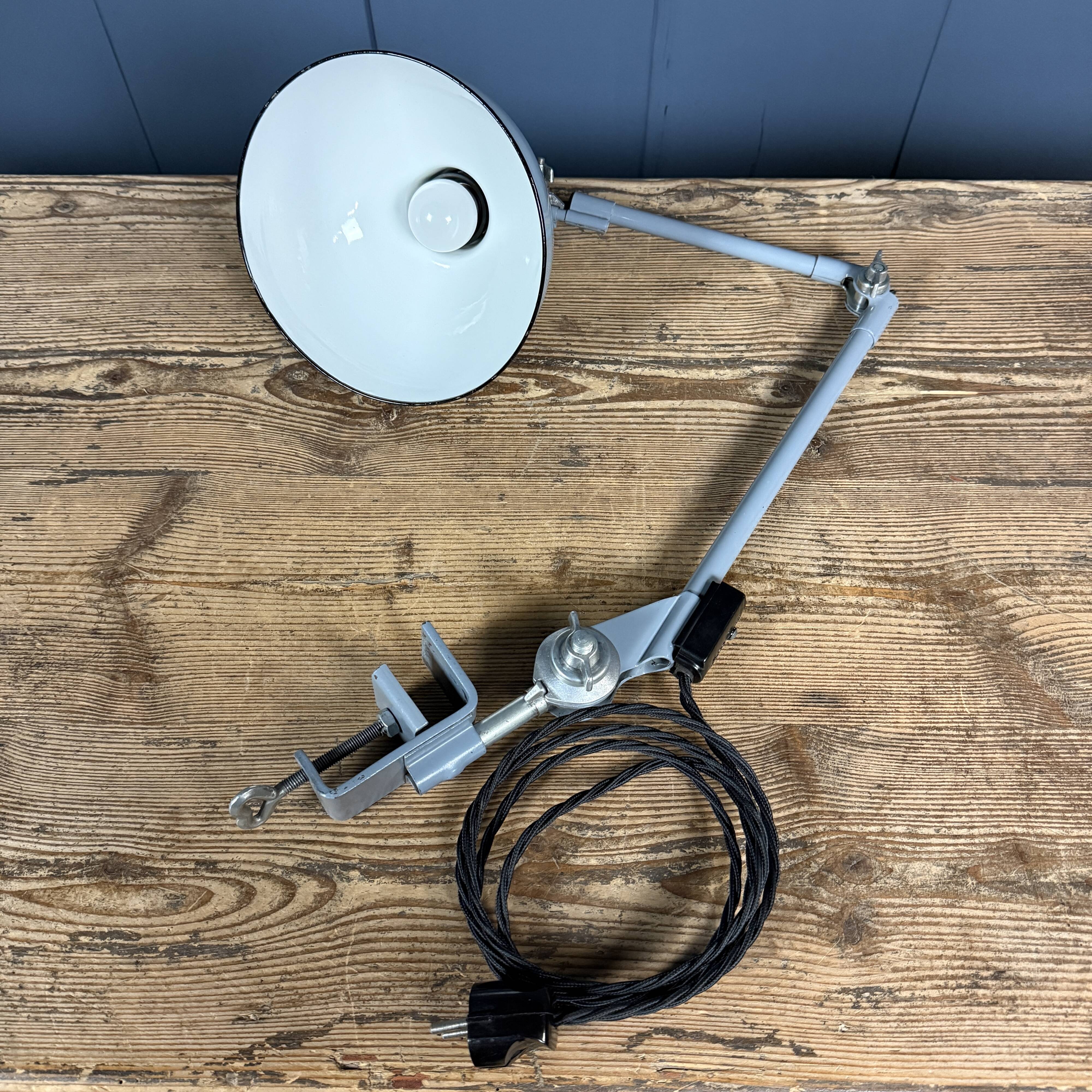 Light grey Rademacher clamp lamp with large enamel shade