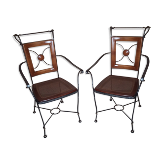 Pair of chairs with armrests