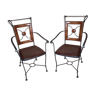 Pair of chairs with armrests