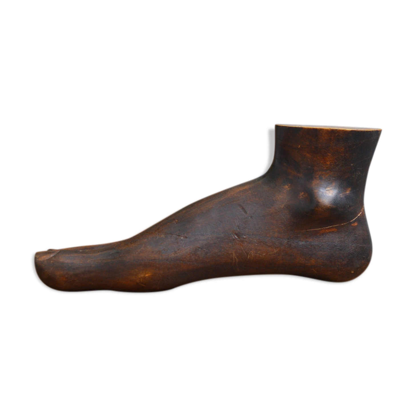 Carved wooden Buddha's foot