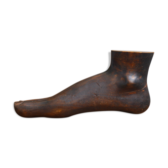 Carved wooden Buddha's foot