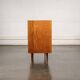 Old TV cabinet with brass handles.