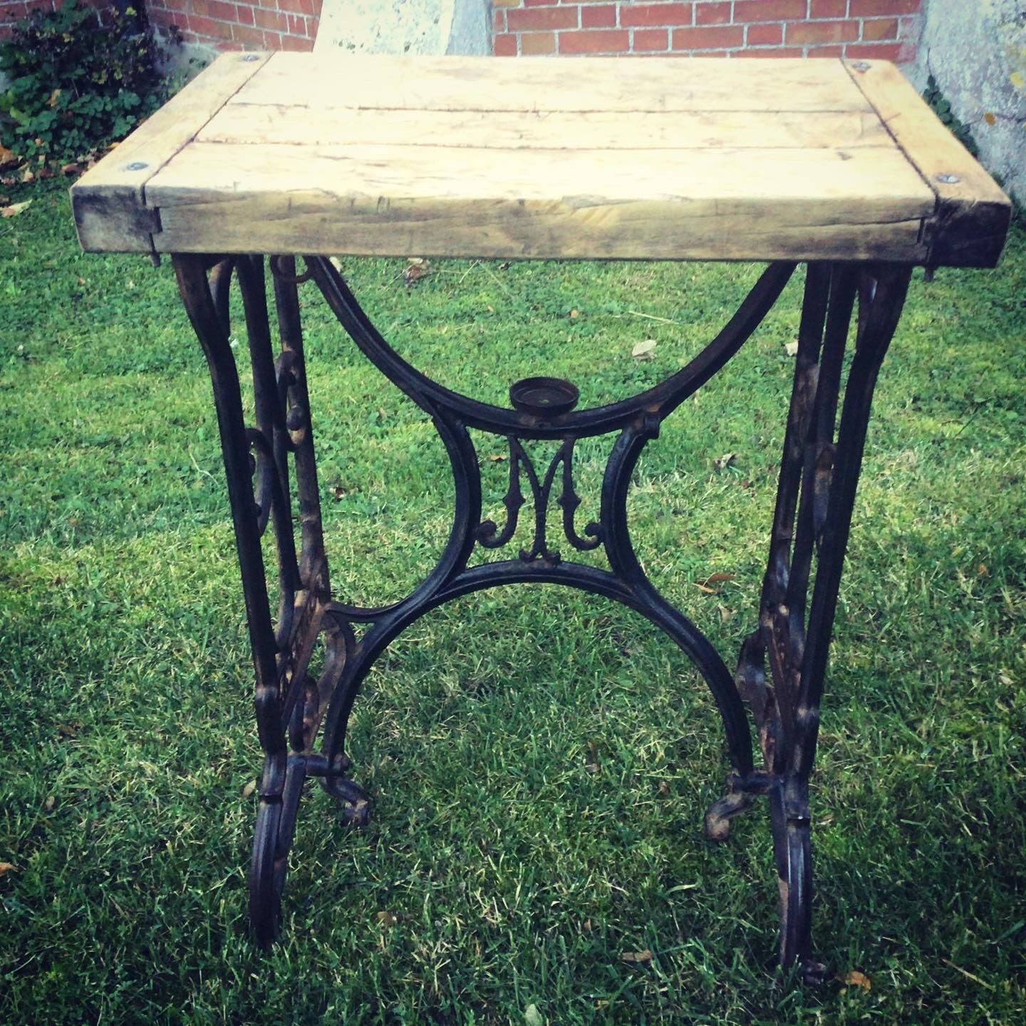 Established solid wood and cast iron console