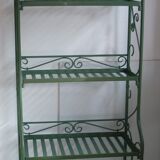 Folding green wrought iron shelf