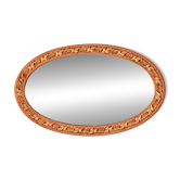 Miroir ovale au cadre doré et travaillé