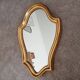 Vintage baroque mirror in gilded wood in the Louis XV style.