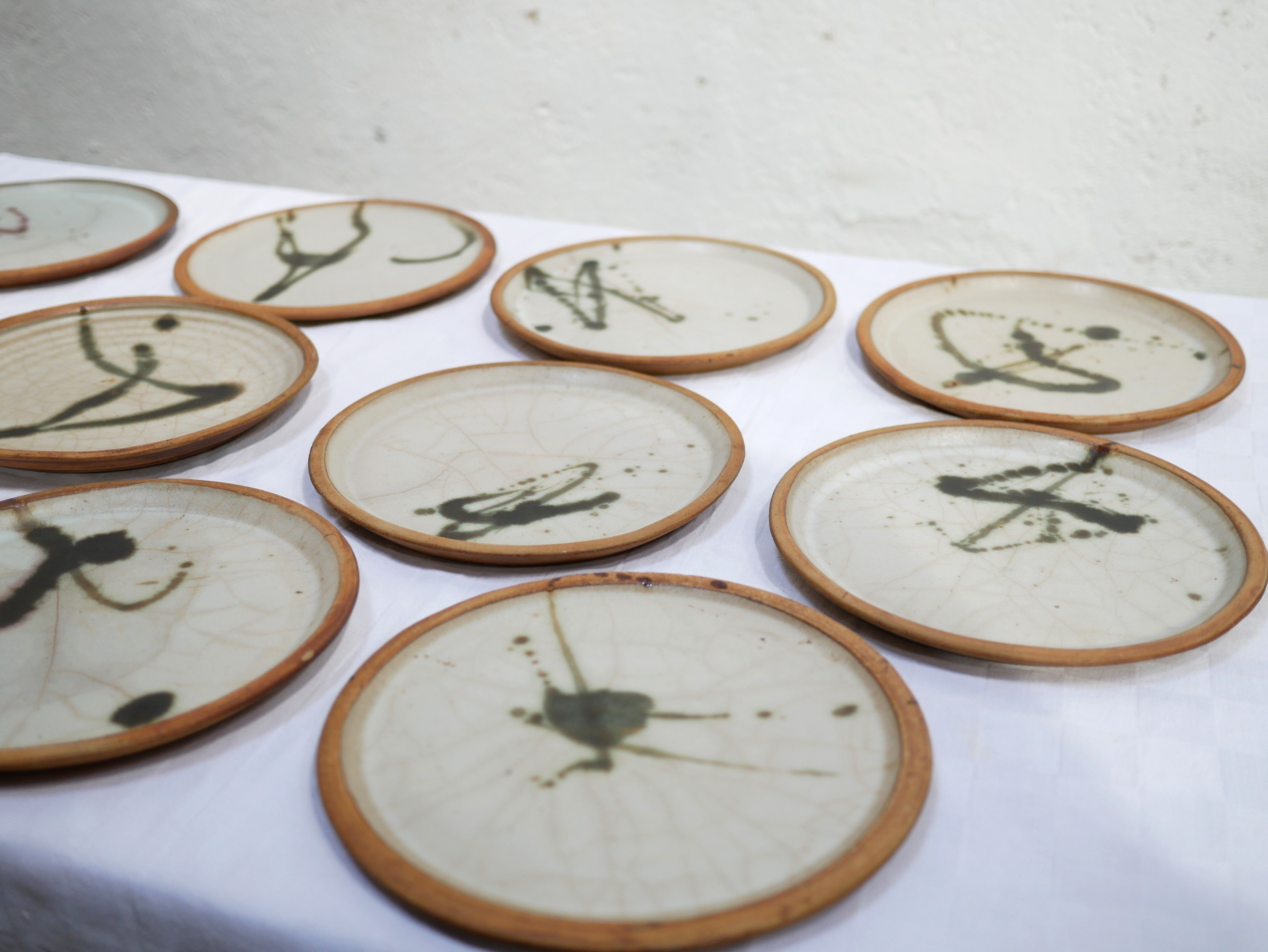 Series of 10 vintage stoneware plates by Madeleine Brault for the Poterie de la Colombe