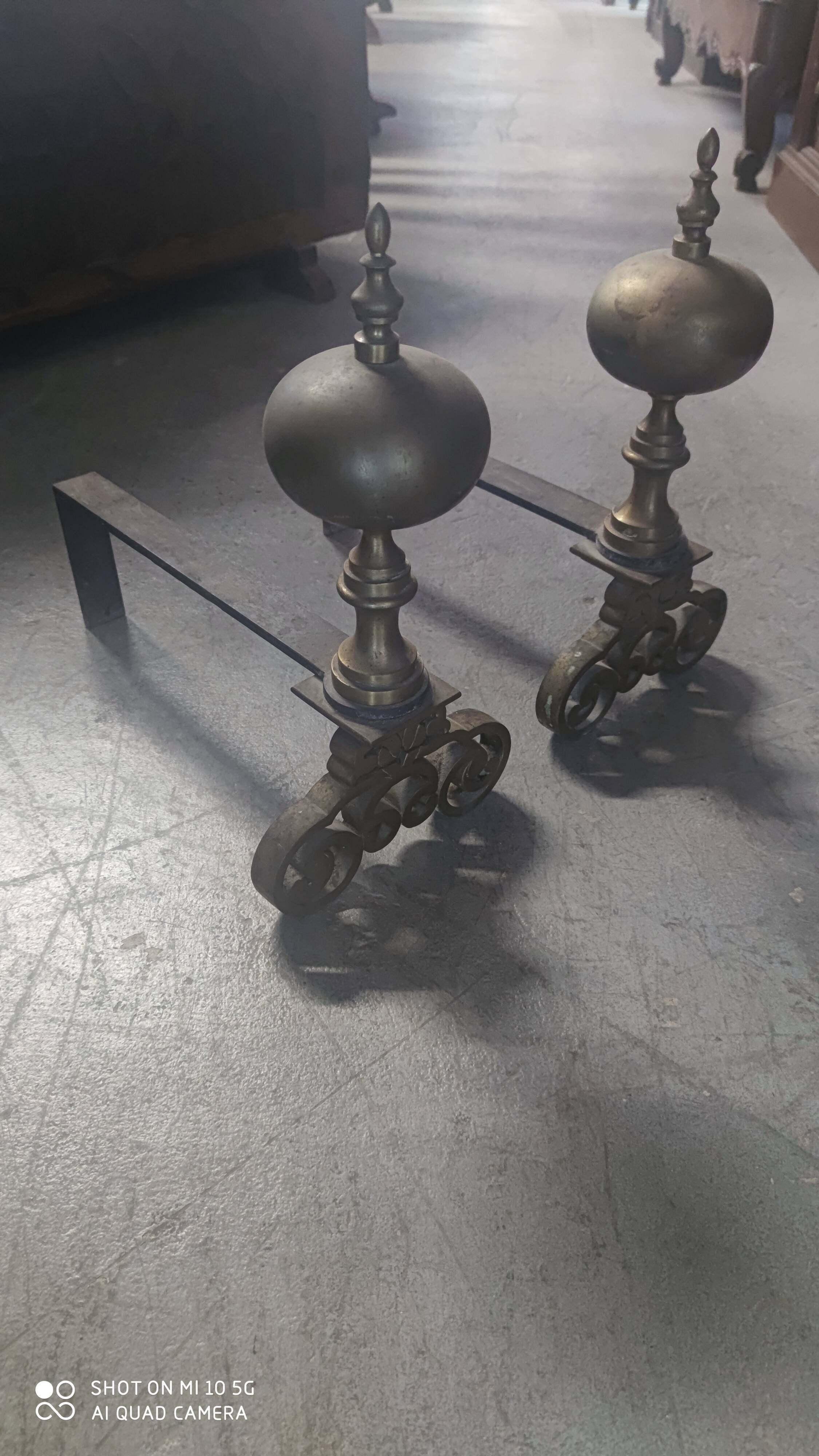 Pair of bronze and steel andirons, 19th century, Holland