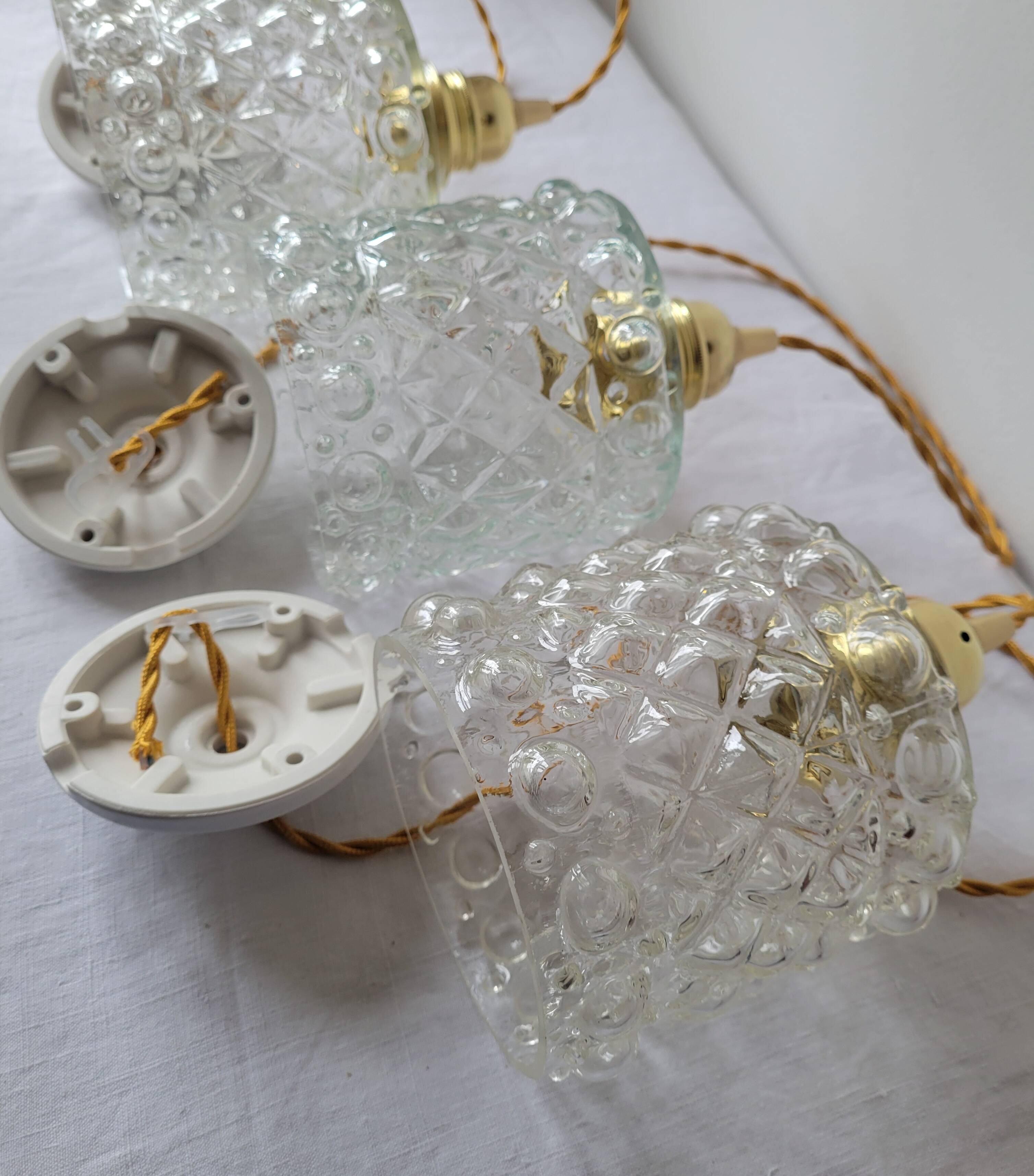 Trio of molded glass pendant lights