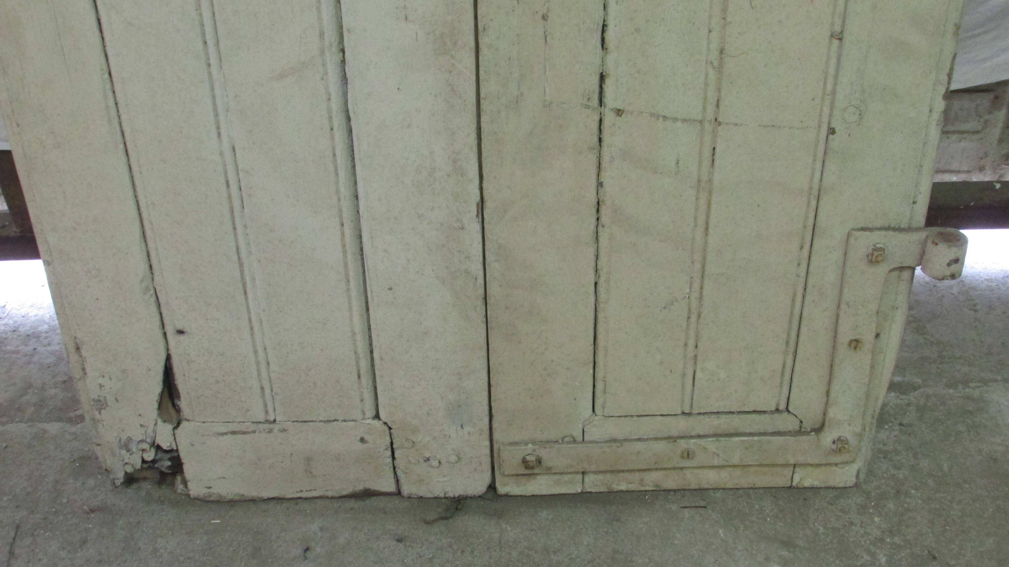 Old shutter in folding wooden louver