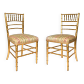 Pair of golden wood chairs in a bamboo style.