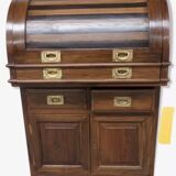 Antique solid wood secretary with a drop-down cylinder compartment.
