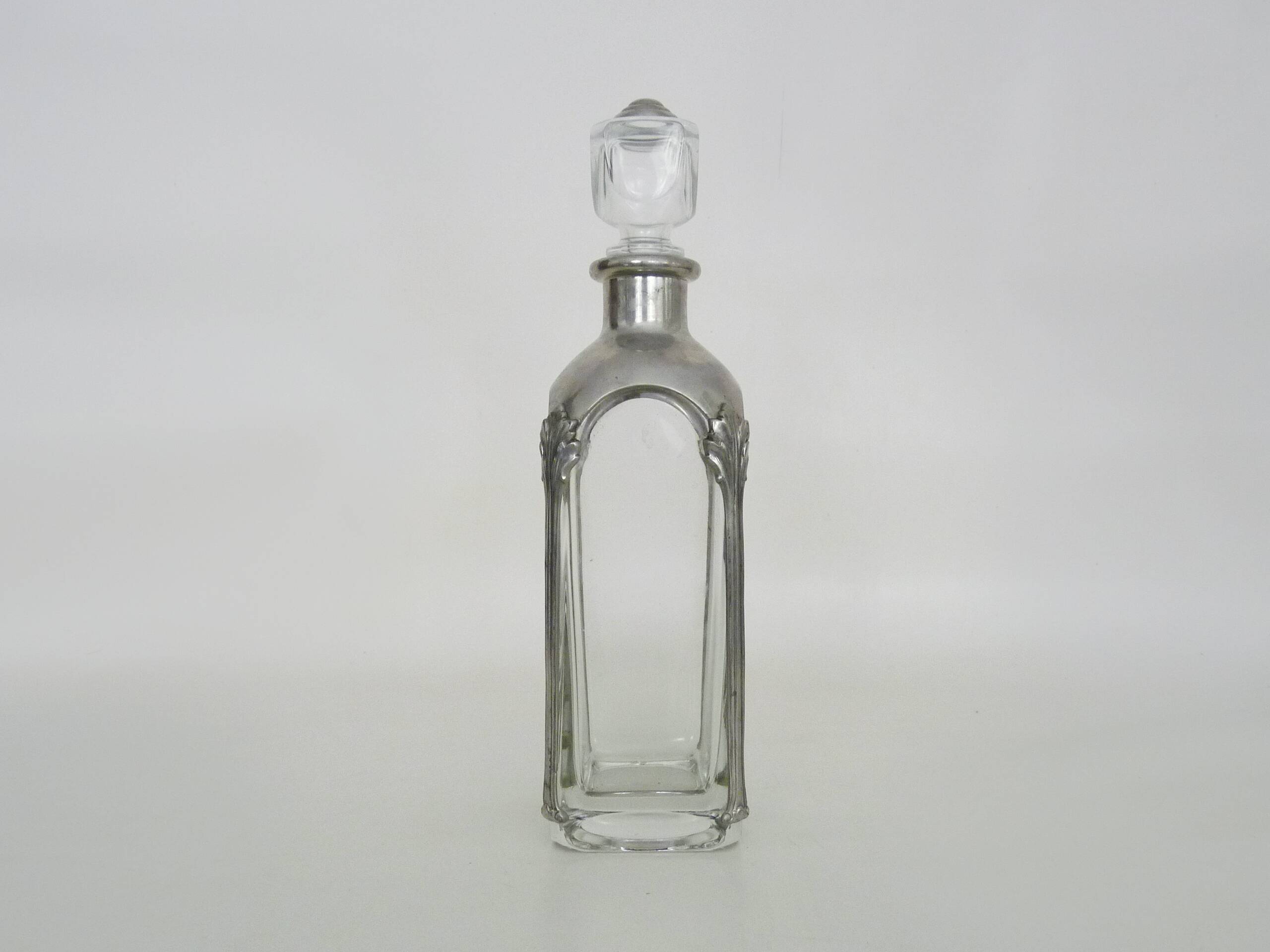 Magnificent crystal and silver-plated metal carafe bottle.
