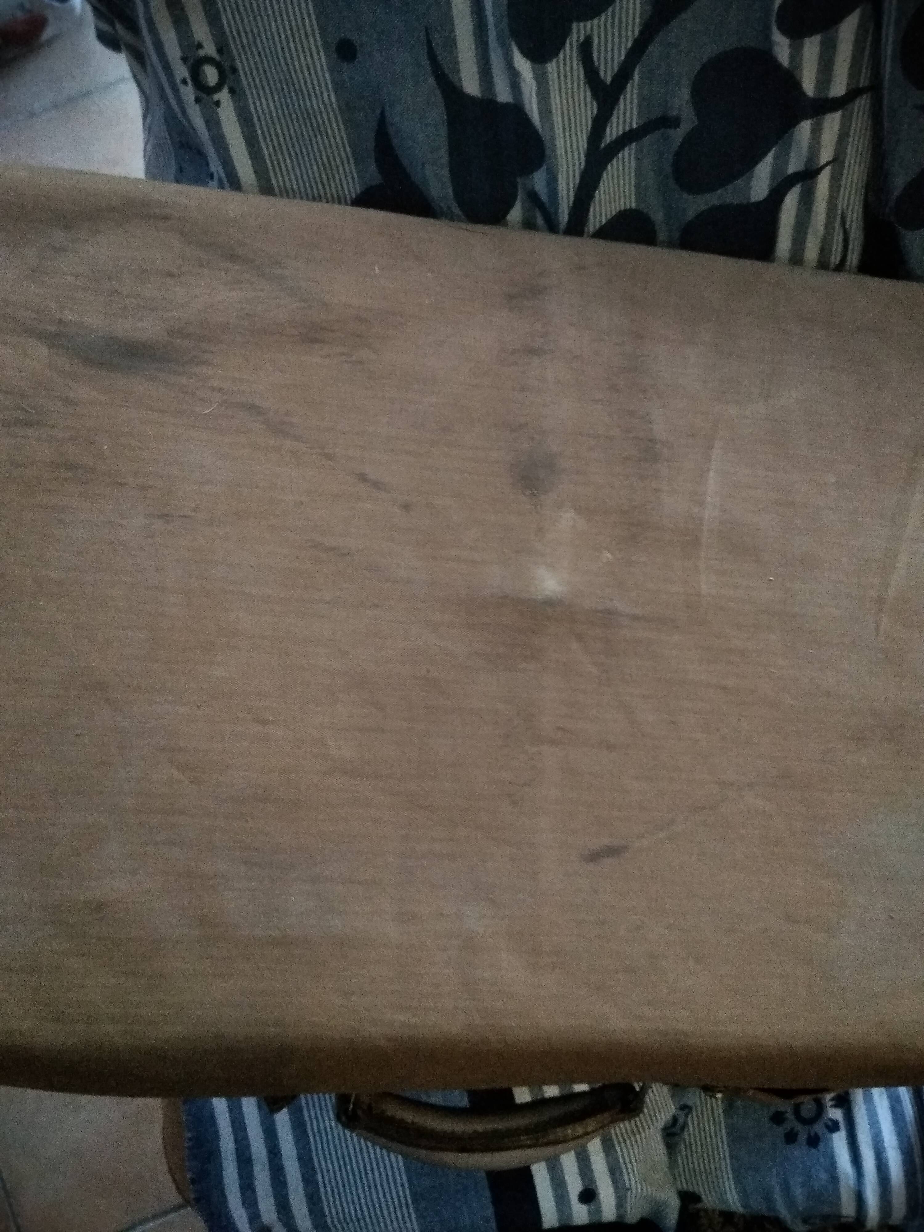 Old leather suitcase with its protective cover
