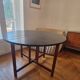 Extendable drop-leaf table for 2 to 5 people - vintage lacquered wood in black