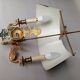 Pair of bronze and sheet metal hot water bottle wall lights