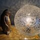 Lampe, veilleuse d'époque Art déco pingouin et globe en verre craquelé