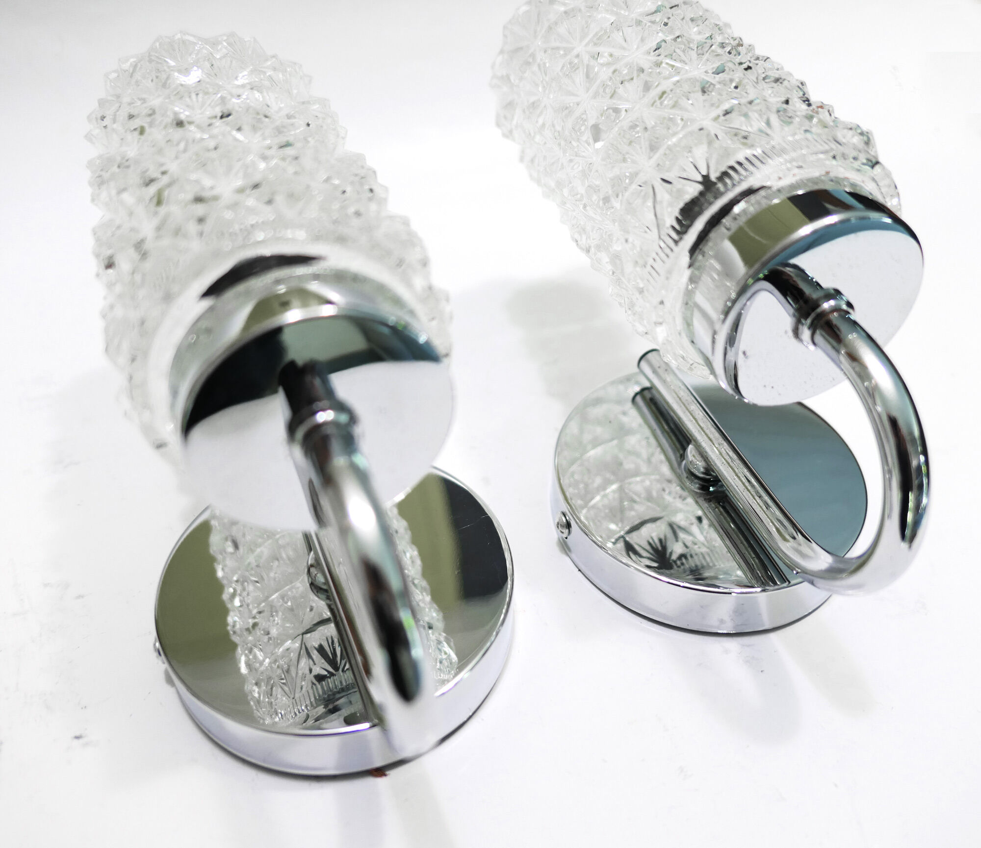 Pair of 1970 chrome metal wall light and molded glass globes.