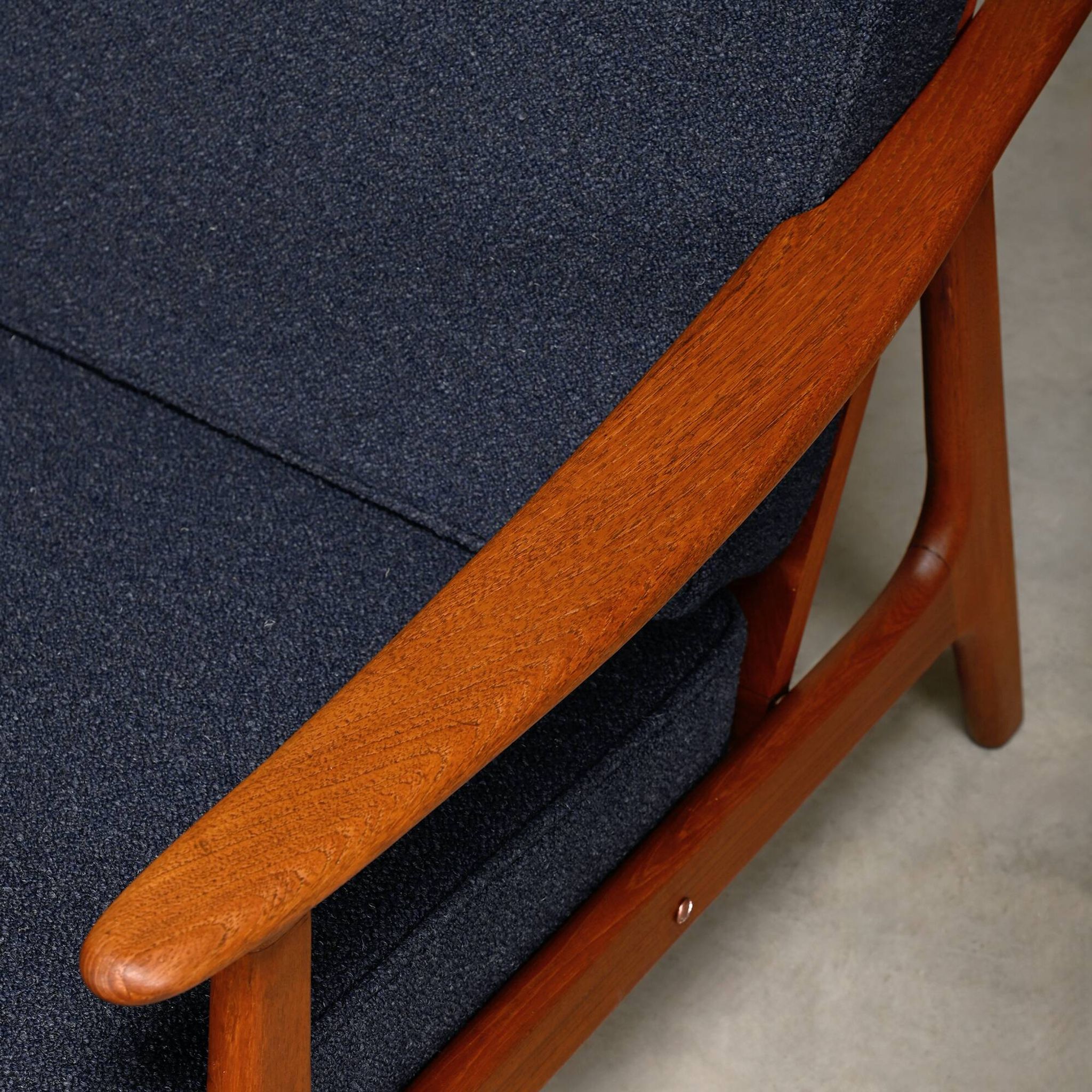 Pair Scandinavian Modern armchairs in teak and dark blue bouclé fabric