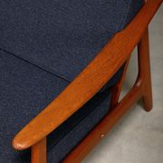 Pair Scandinavian Modern armchairs in teak and dark blue bouclé fabric