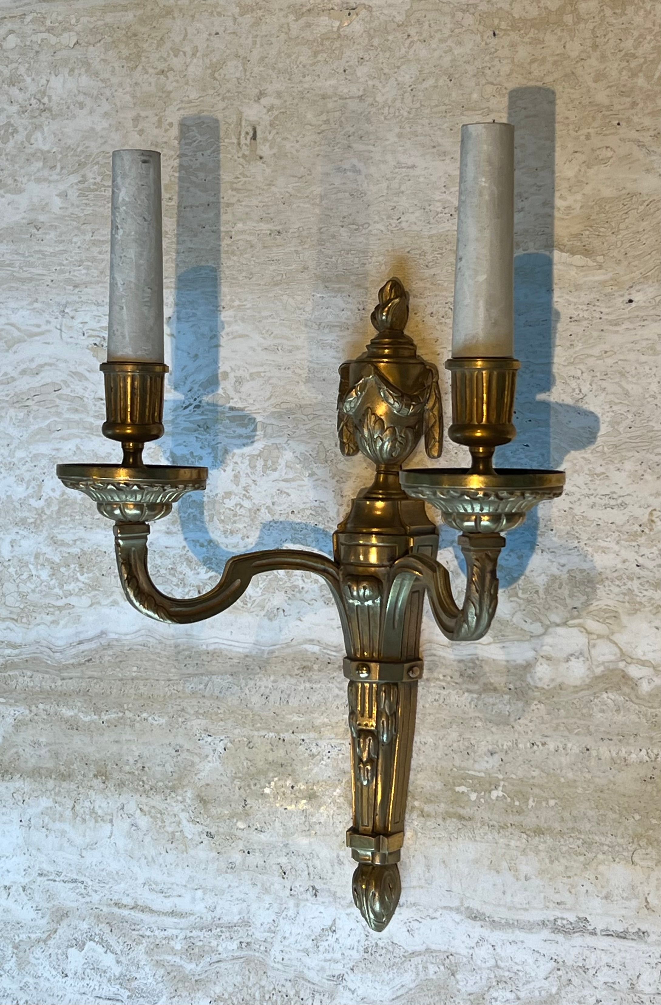 Set of 4 bronze wall lights in Louis XVI style.