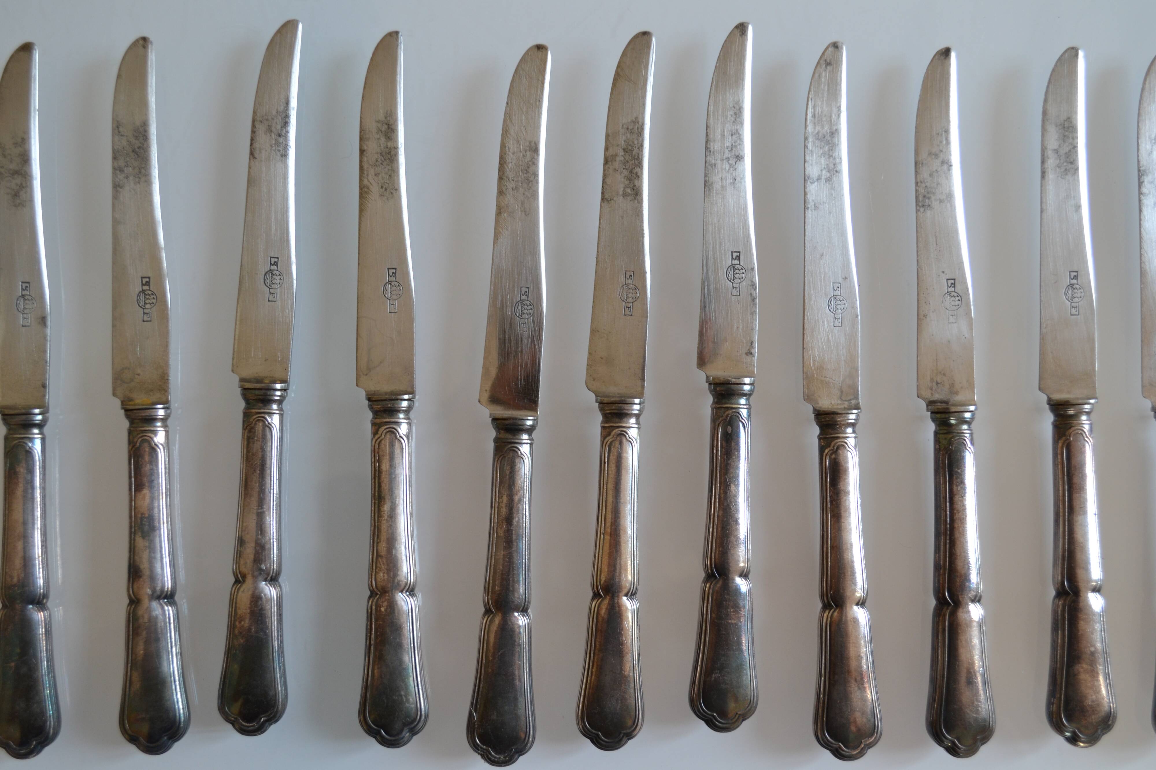 12 silver metal dessert or cheese knives