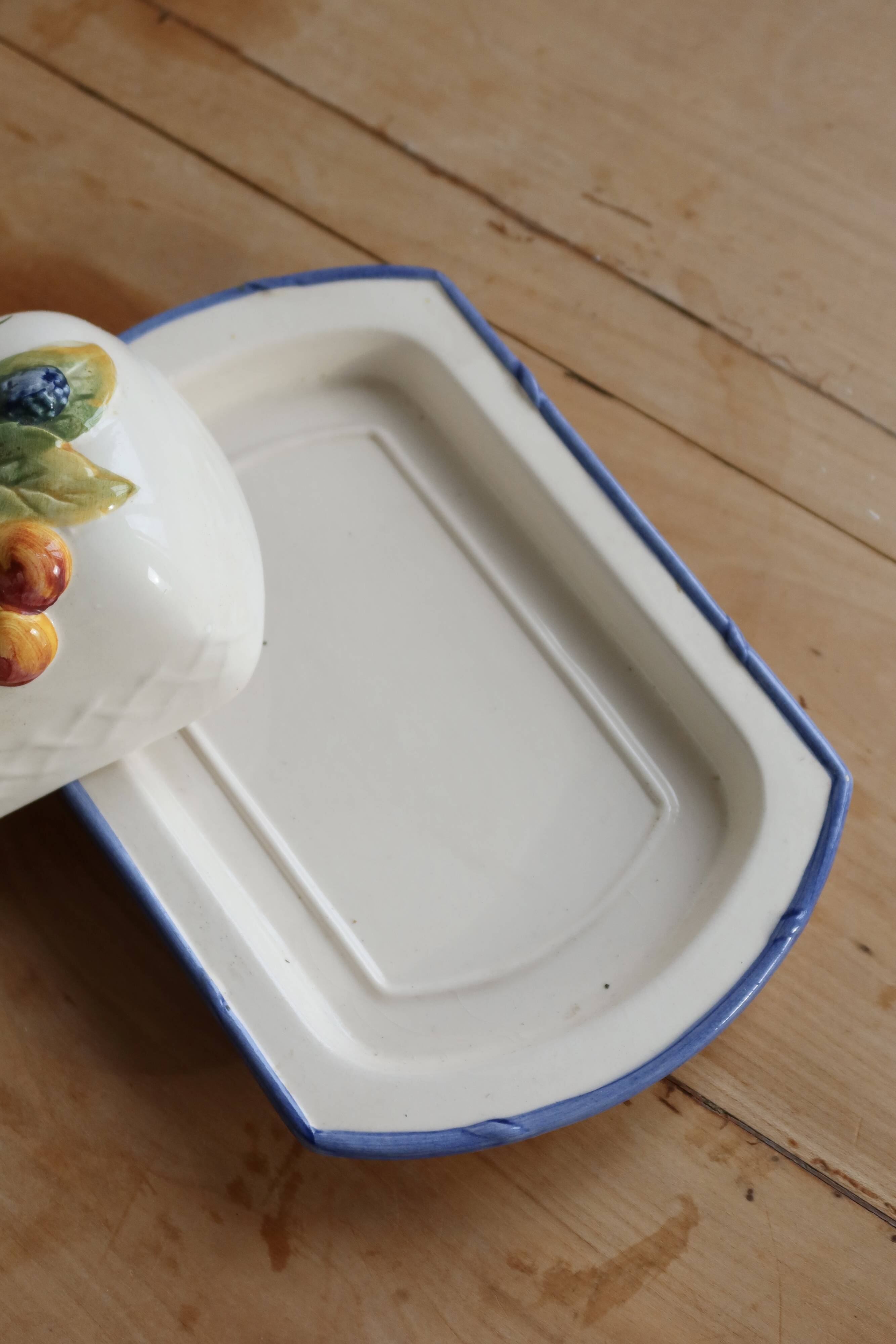 Large vintage faience butter dish with slip decoration – Fruit design