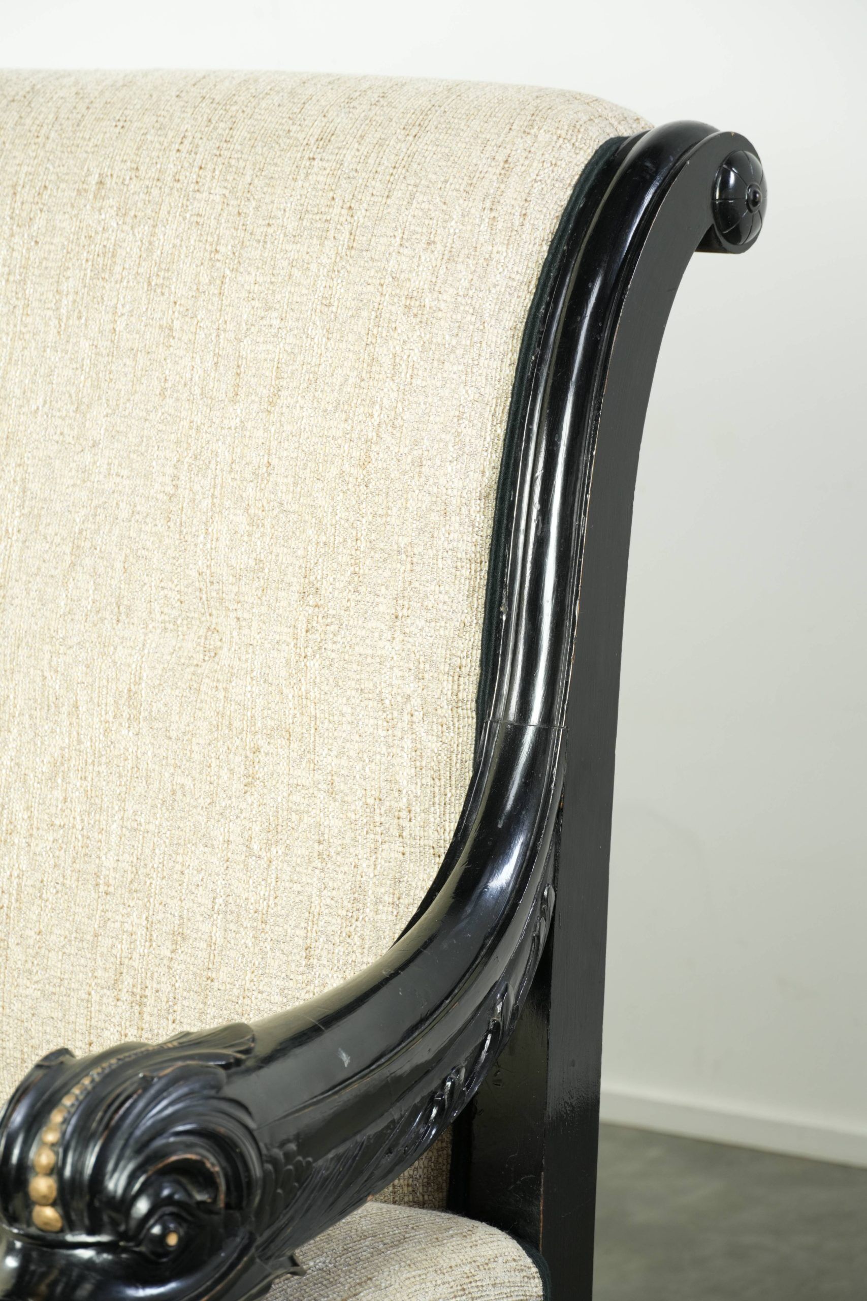 French sofa from the 19th century in Empire style with detailed armrests