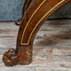 Bishop's curule armchair in solid walnut and gilding highlights with religious symbols