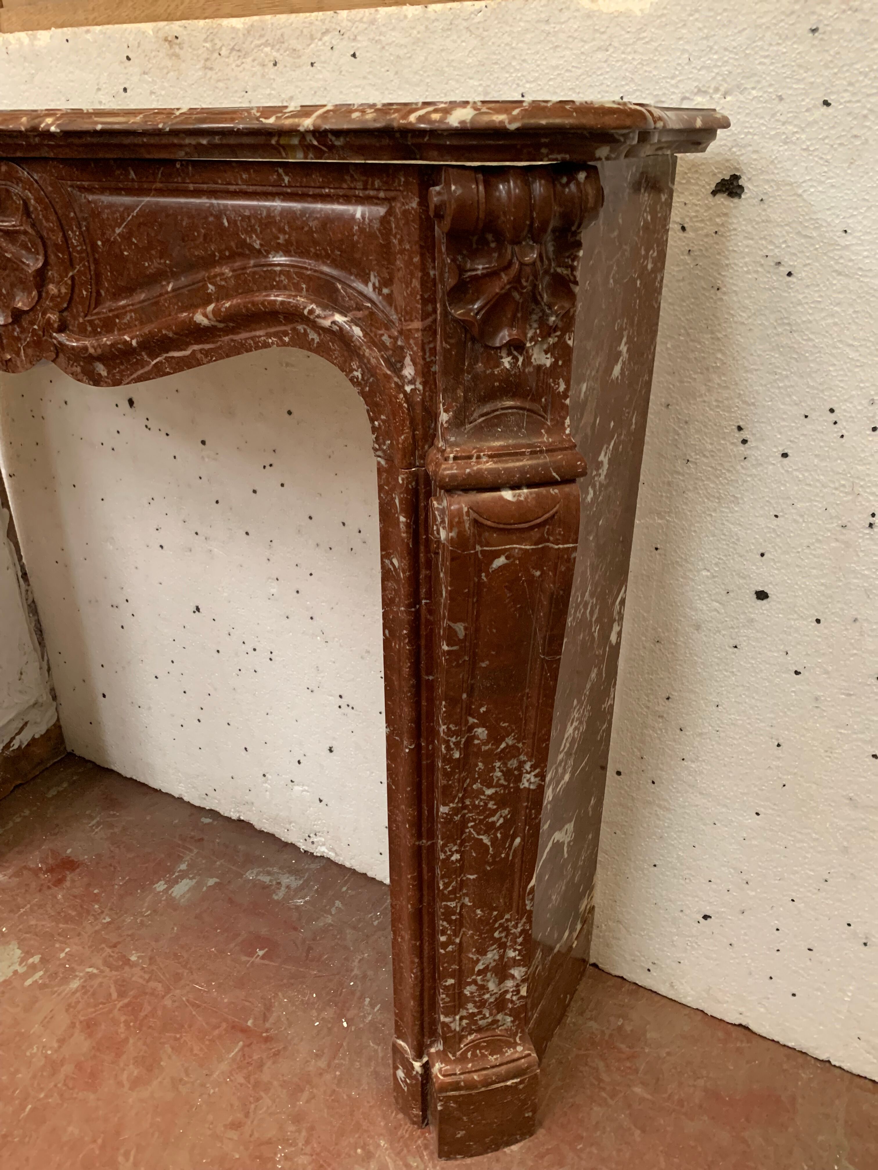 Fireplace three shells louis XV style in royal red marble XIX century
