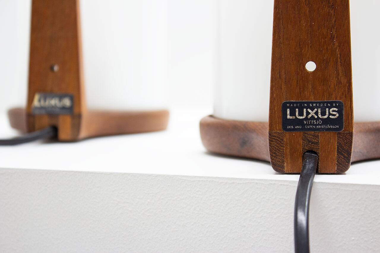 Pair of teak & acrylic sconces by Luxus, Sweden