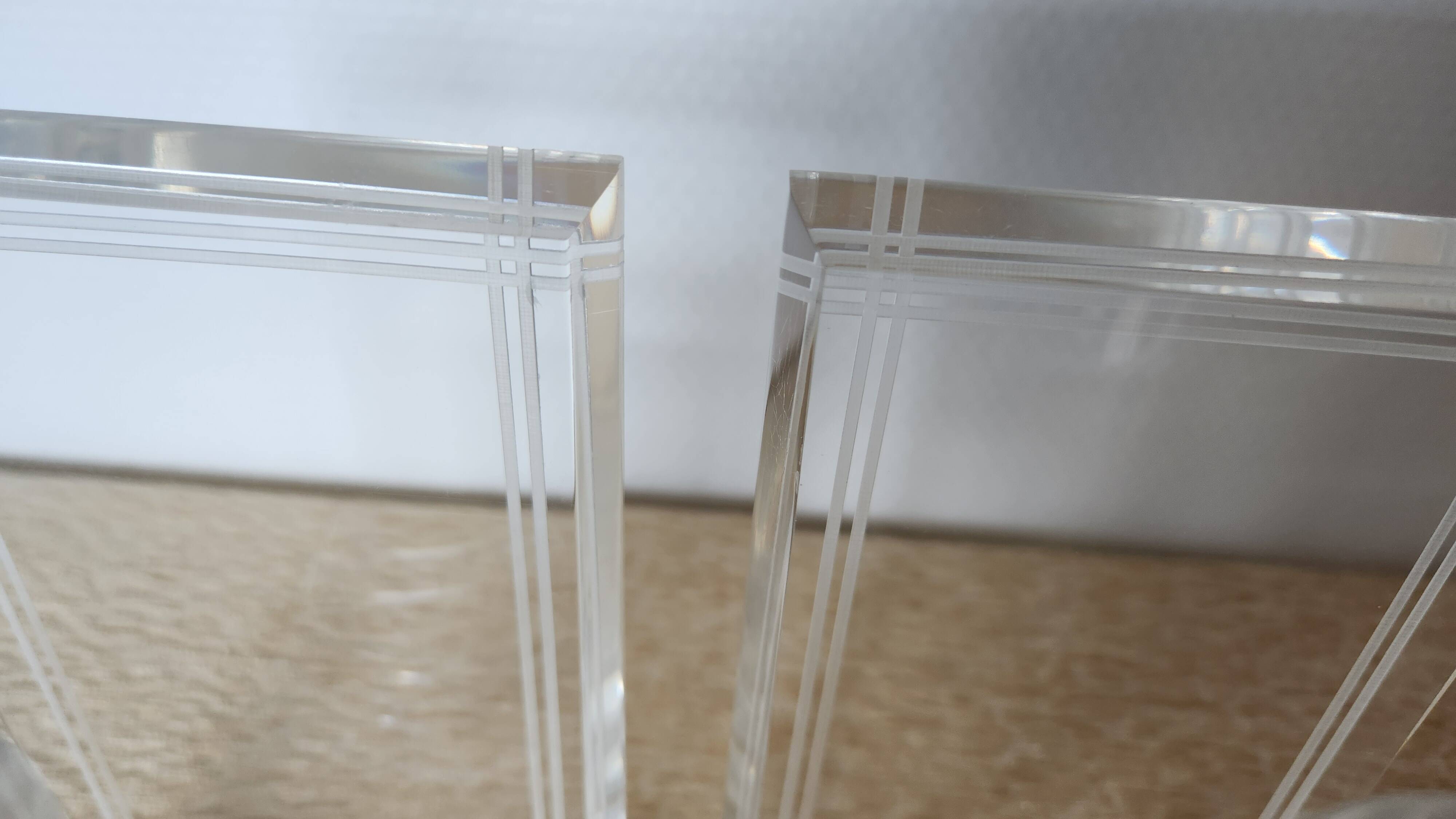 Pair of column bookends in plexiglass and gold metal, 1980s design.