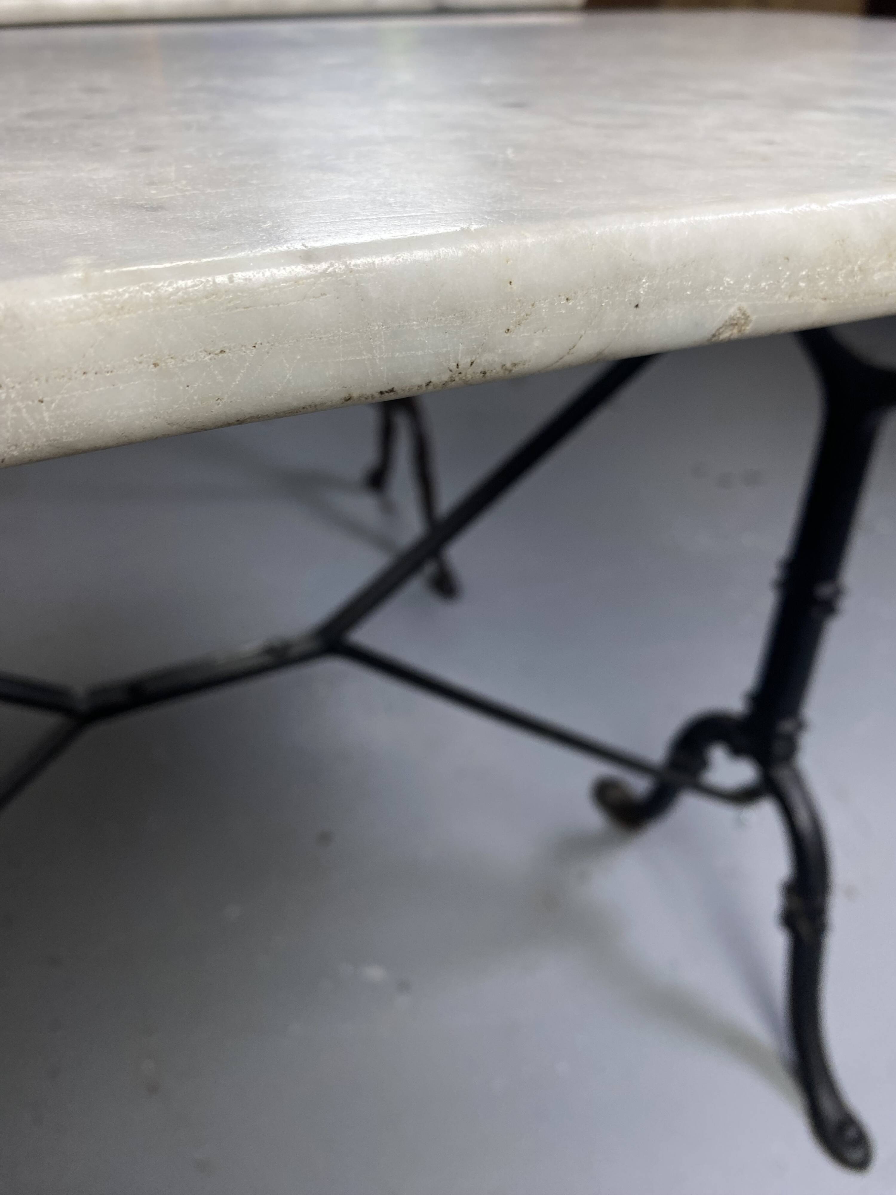 Set of two bistro tables in marble and wrought iron