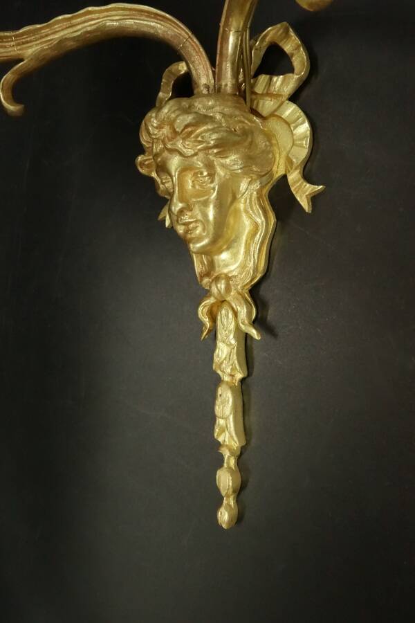 Large pair of wall sconces with male faces in Louis XV style - gilded bronze