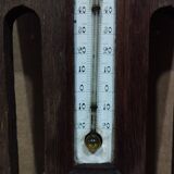 Old barometer and thermometer from the 1930s in carved wood. Signed on the back EH PARIS.