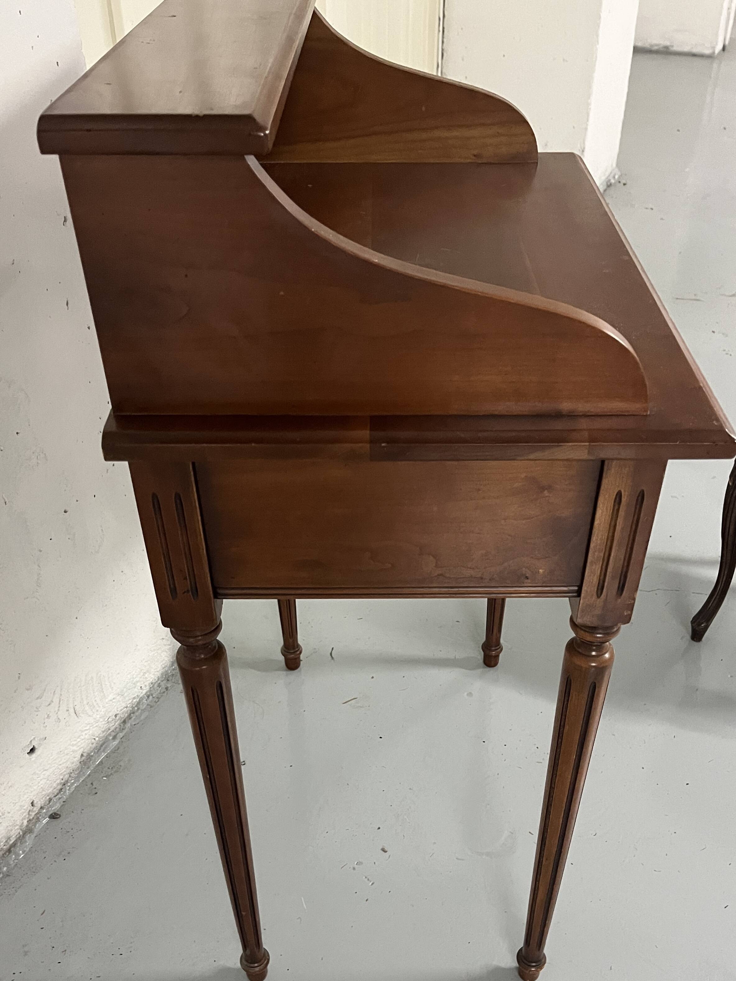 Old-fashioned secretary desk and chair set.