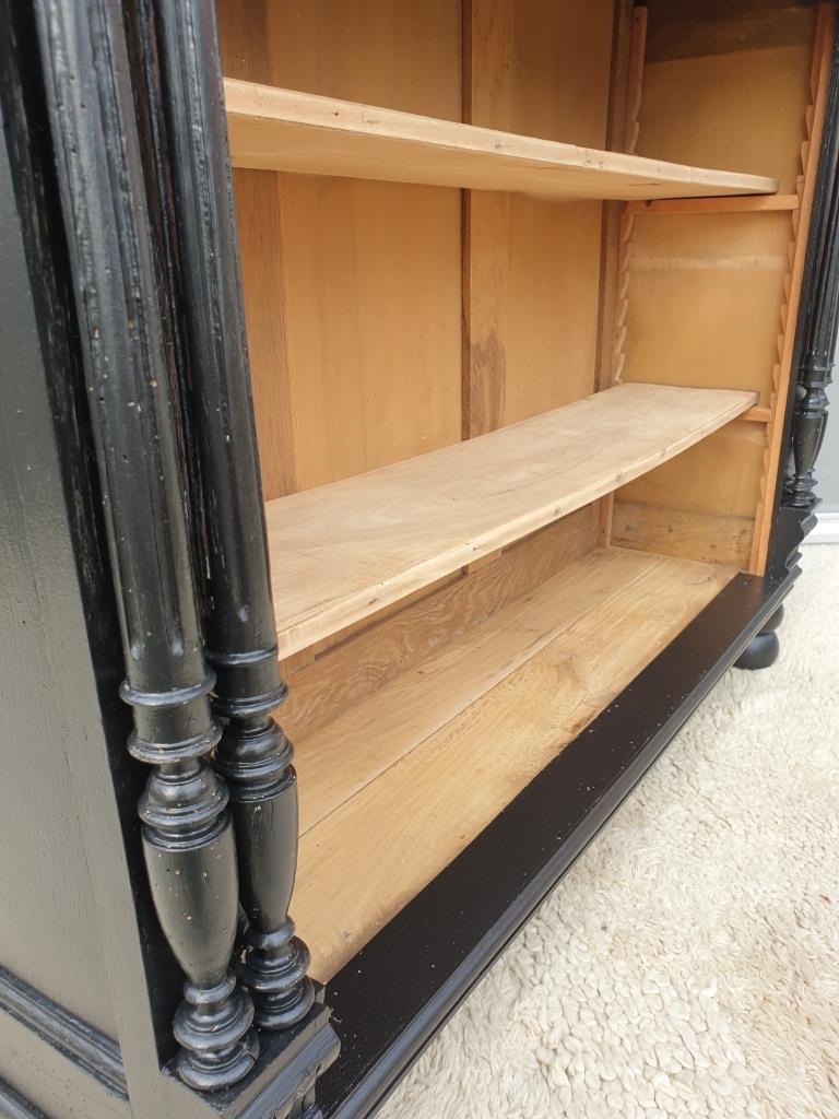 Neoclassical black wood bookcase with columns
