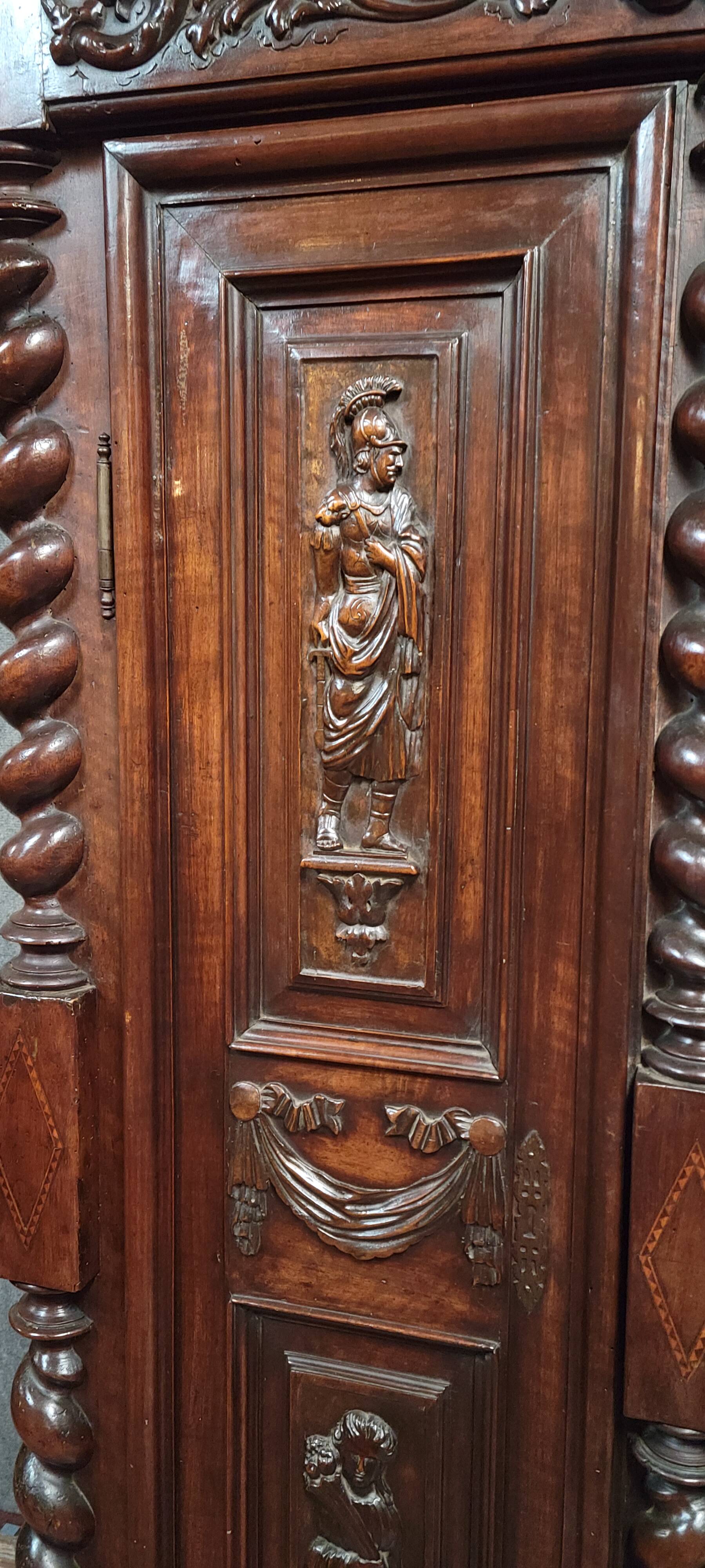 Renaissance style wardrobe in richly carved solid wood, 17th century