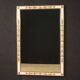 Miroir laqué et doré de style Louis XVI