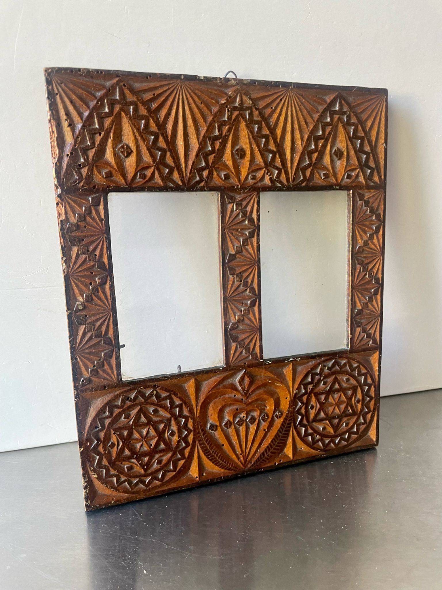 Double frame intricately carved wood