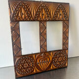 Double frame intricately carved wood