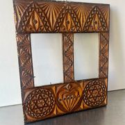 Double frame intricately carved wood