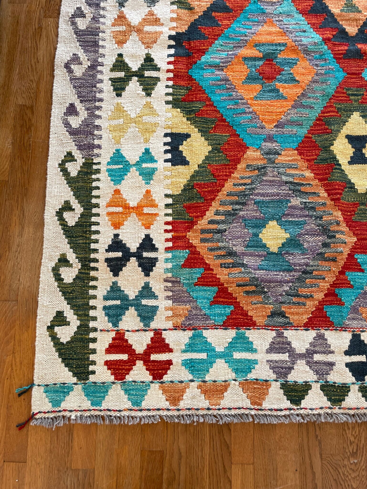 Oriental kilim rug afghan colored red and multicolored