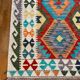 Oriental kilim rug afghan colored red and multicolored