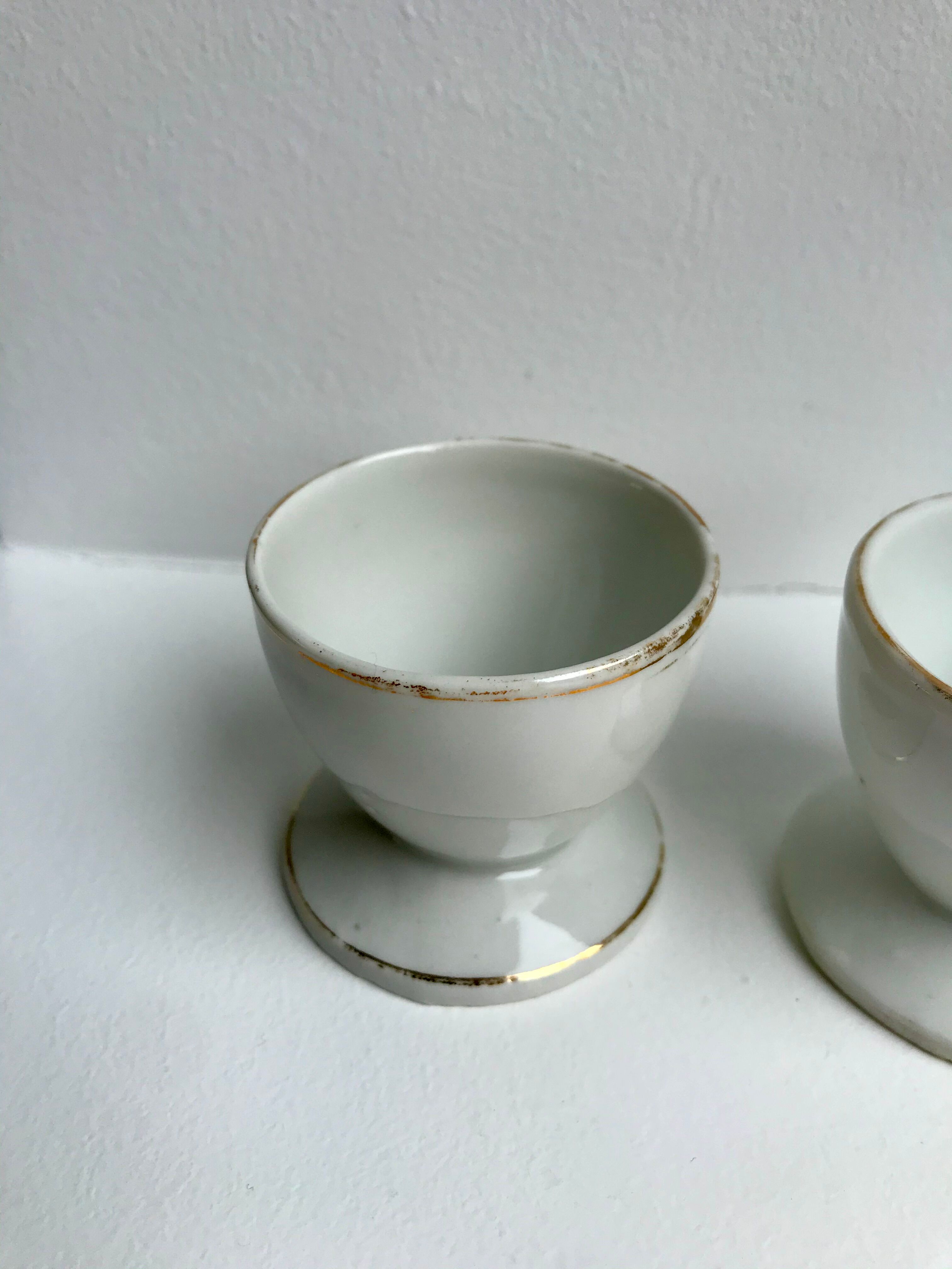 Trio of white shells bordered gold 50s