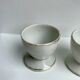 Trio of white shells bordered gold 50s